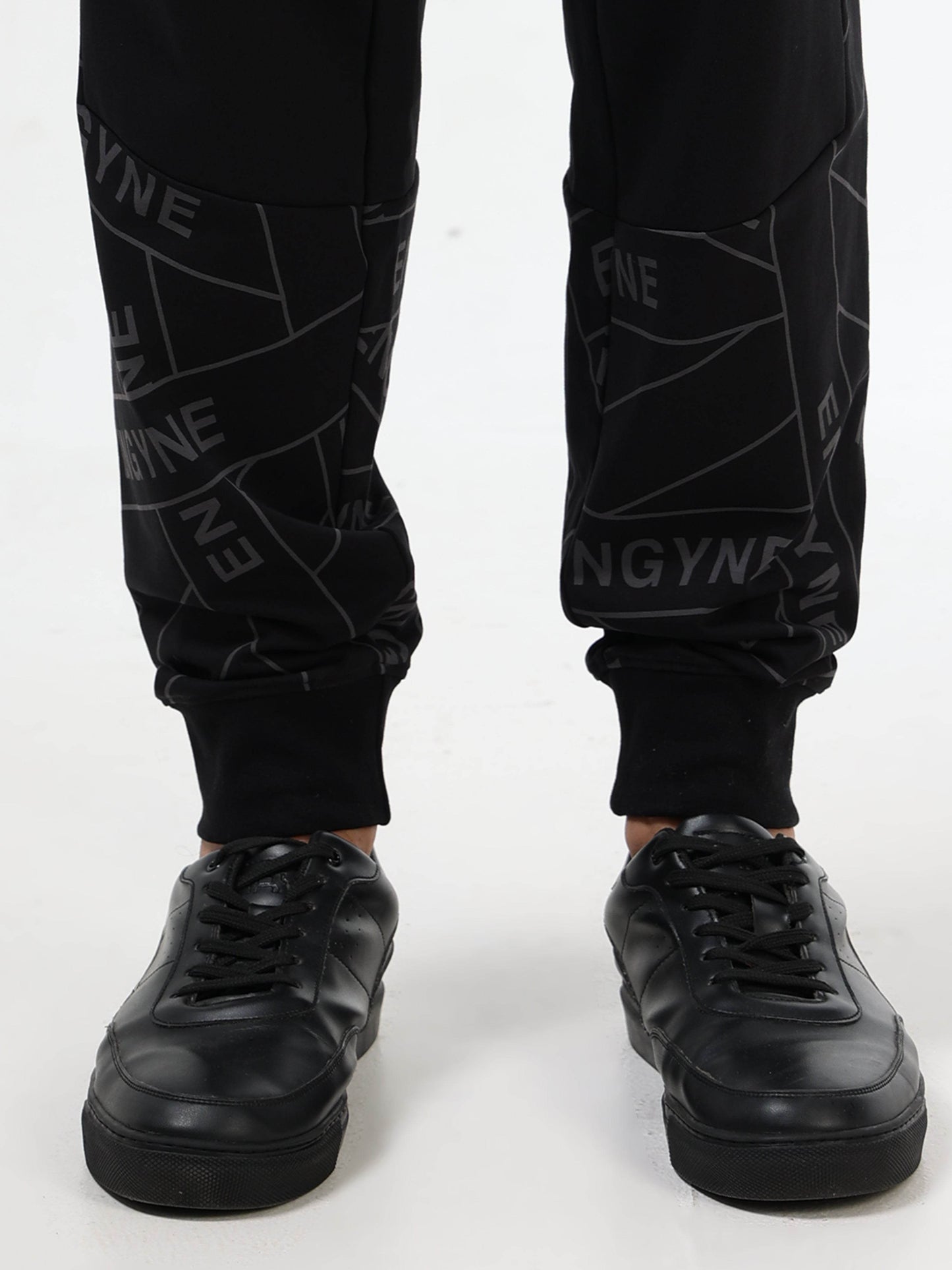 Regular Fit Cut and Sew Joggers in Cotton Poly Lycra Rougen Loop Knit with All Over ENGYNE Rotary Discharge Print - Black - ENGYNE