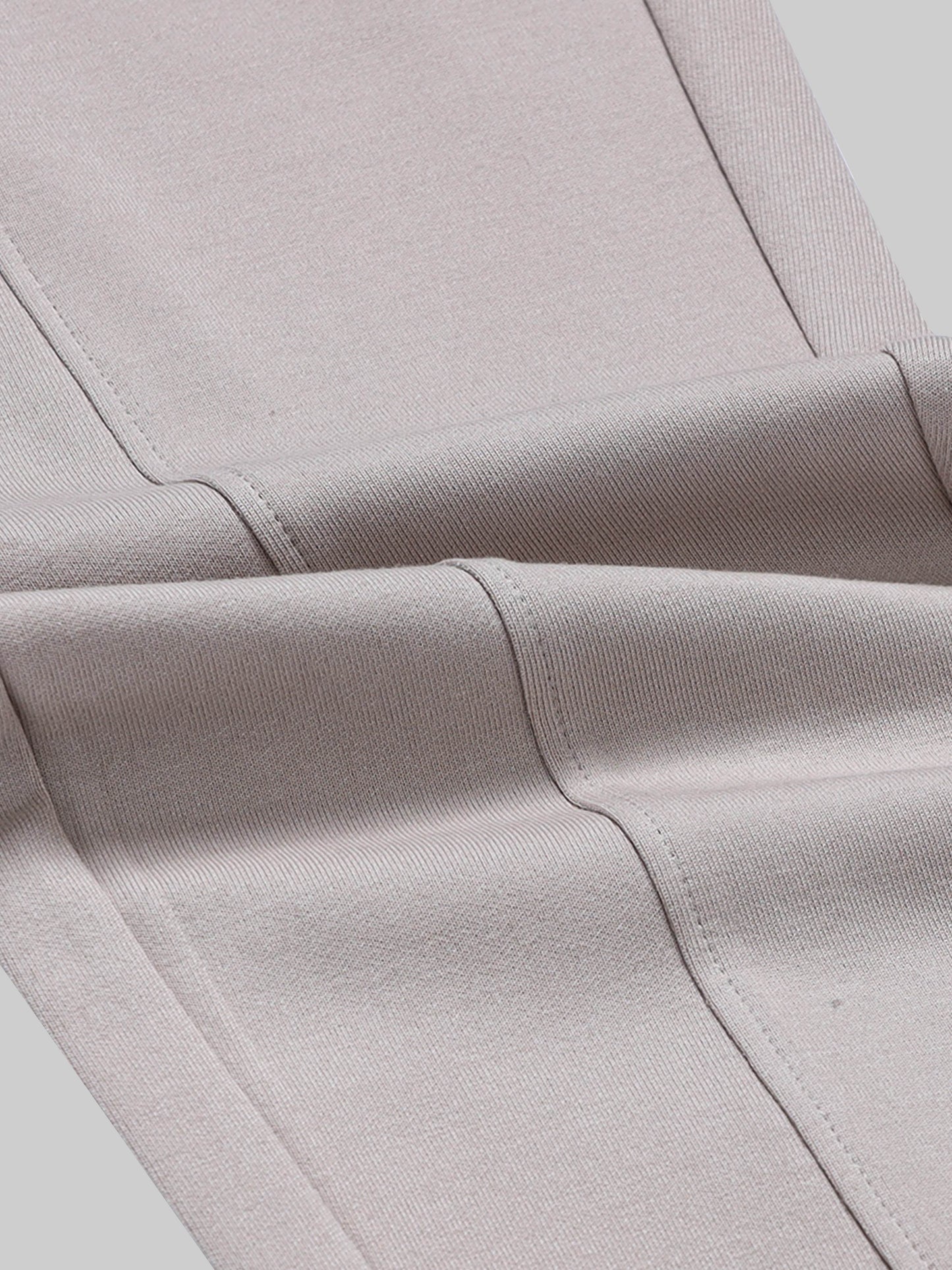 Rougen Cotton Poly Elastane Interlock Jogger with Cut-and-Sew Design and 4-Color Flag Tape Sand - ENGYNE