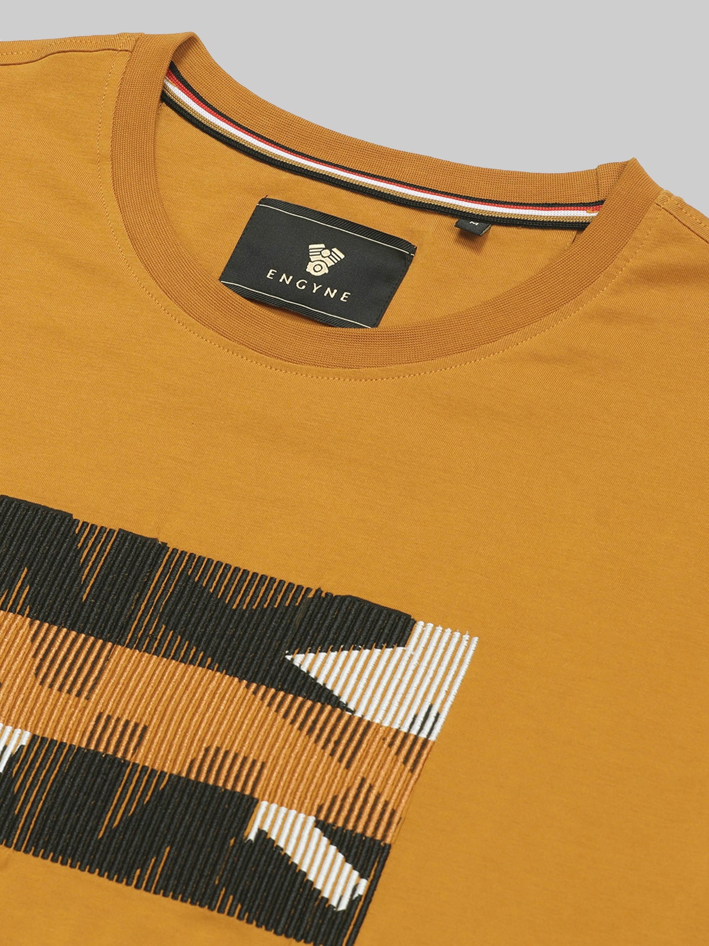 Regular Fit T-shirt in Supima Cotton Lycra with Non-PVC Print and Chest Embroidery Featuring Branded Artwork Play - Mustard - ENGYNE