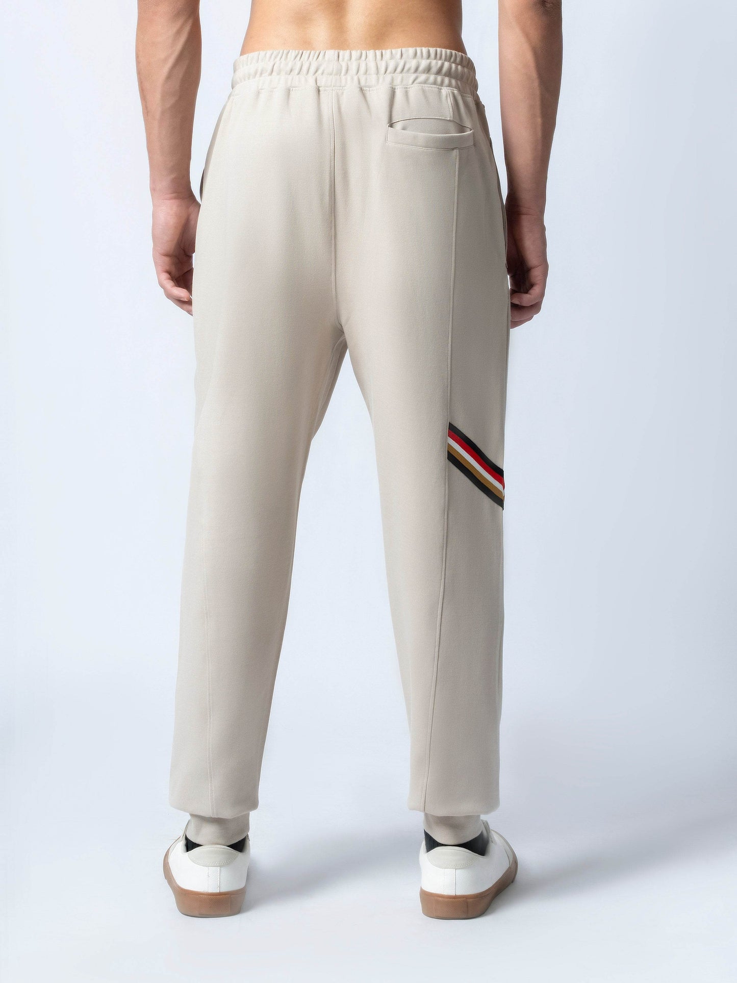 Rougen Cotton Poly Elastane Interlock Jogger with Cut-and-Sew Design and 4-Color Flag Tape Sand - ENGYNE